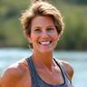 Elena R., a smiling woman in her 50s, outdoors with a healthy glow.