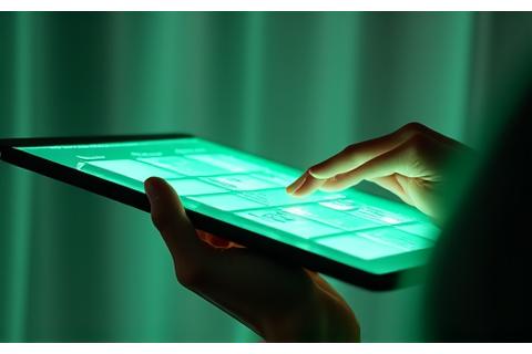 Person using tablet with wellness app, representing technical support